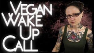 Emily is seen sat facing the camera with “Vegan wake up call” in large white letters emblazoned on the image next to her.