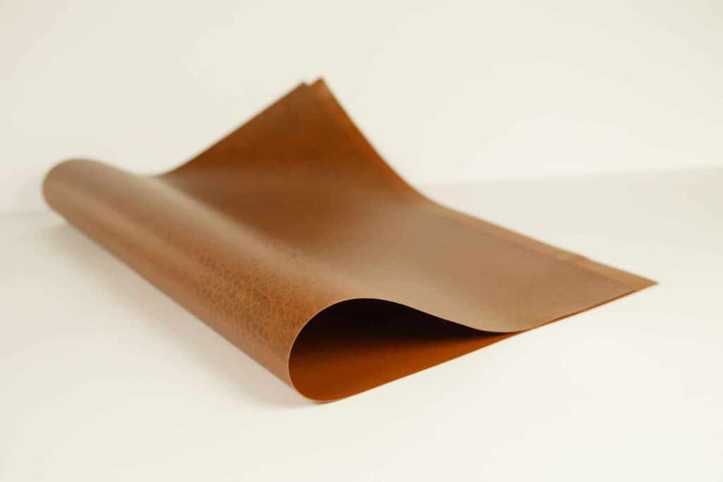 A sheet of PVC synthetic leather alternative folded over on itself.