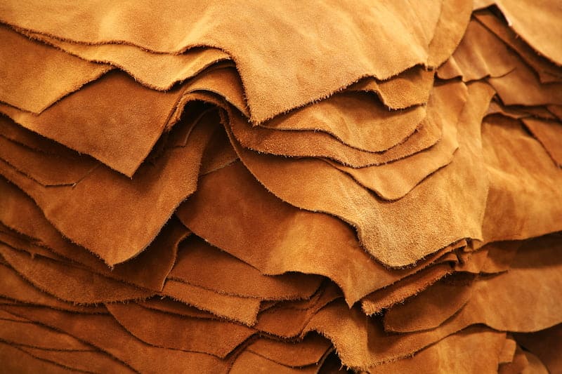 A stack of tanned leather, often incorrectly viewed as a byproduct of the meat industry.
