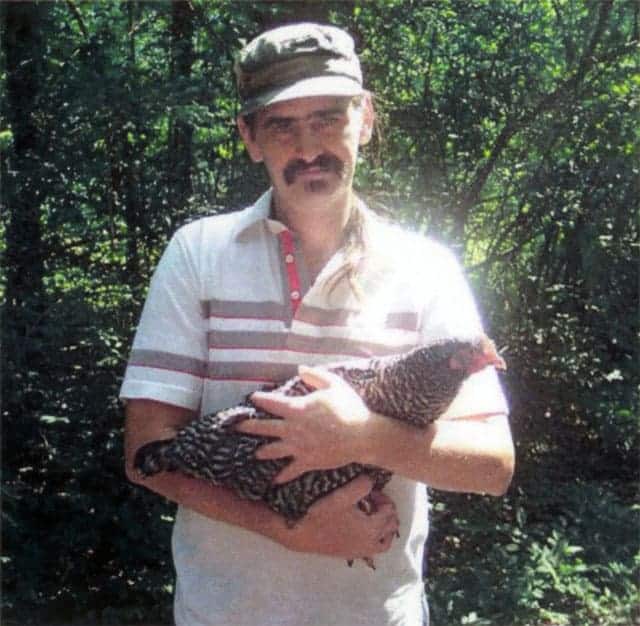Virgil Butler, a former slaughterhouse worker turned activist, holding a chicken.