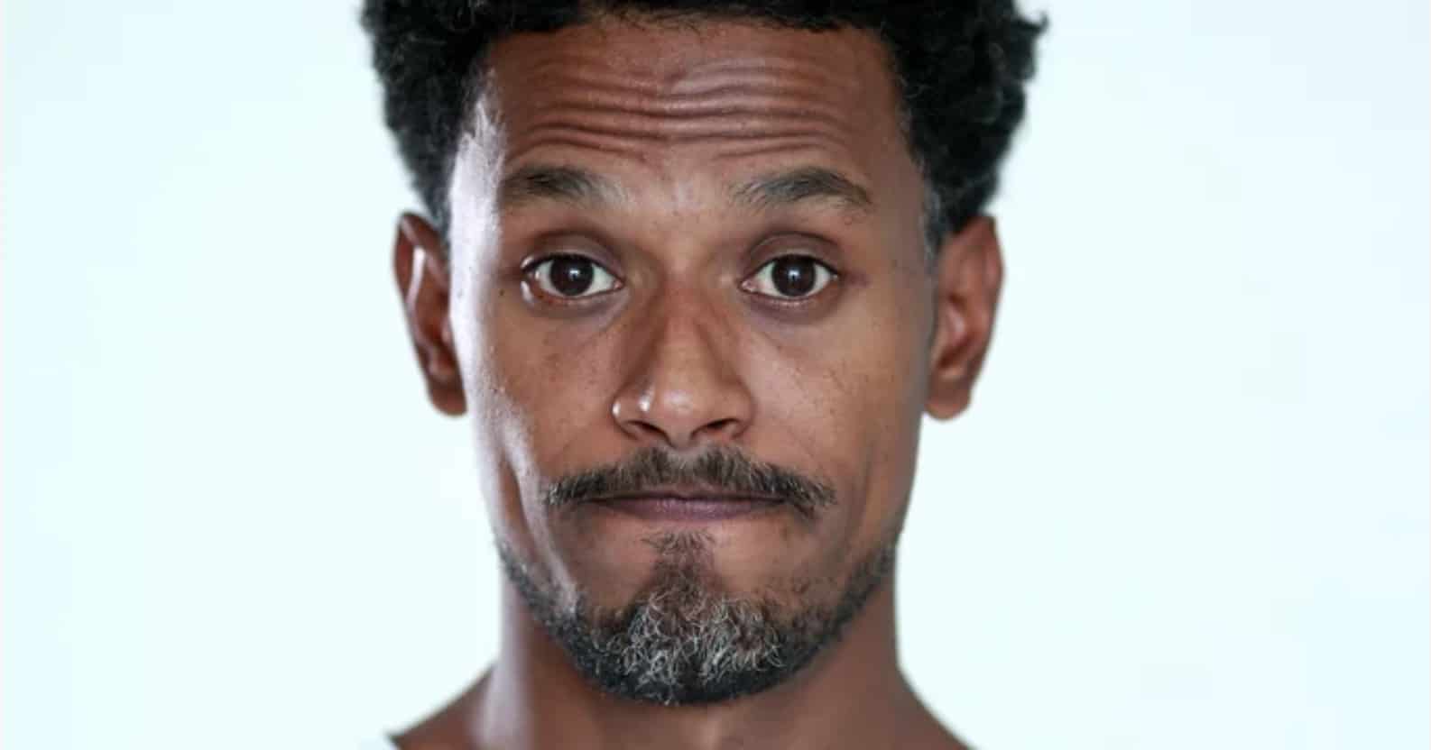 A Black man with an expression that could be read any number of ways, much like the layered findings that people think vegans think they’re better than everyone (and some vegans do…and so do non-vegans). Vegan's perceived self-righteousness is one of the main reasons given for why people "hate" vegans.